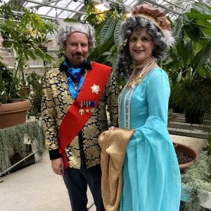 Louis XVI (Ed Cobb) and Marie Antoinette (Karen St. Clair) entertained more than 90 Ithaca High School students who visited the Conservatory Tuesday. The royalty helped the students make connections between their study of the French Revolution and the plants in the Conservatory.